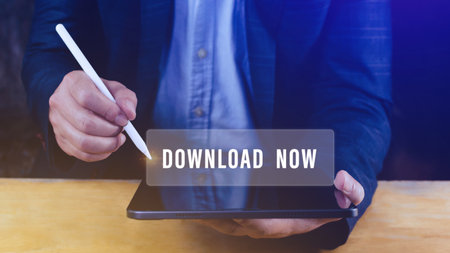 Businessman pressing button download now on virtual screens, business, technology, internet and networking concept.の写真素材