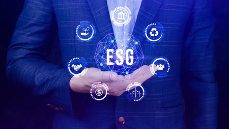 ESG icon concept in the hand for environmental, social and governance in sustainable and ethical business on the Network connection, businessman pressing button on screen.の写真素材