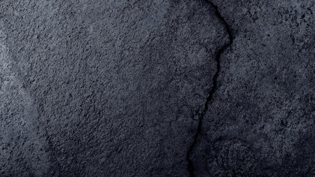 Cracked wall texture cement concrete floor background, Plaster facade house wall with grey dark cracks abstract backgroundの写真素材