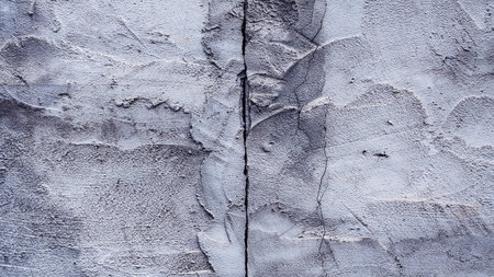 Cracked wall texture cement concrete floor background, Plaster facade house wall with grey dark...