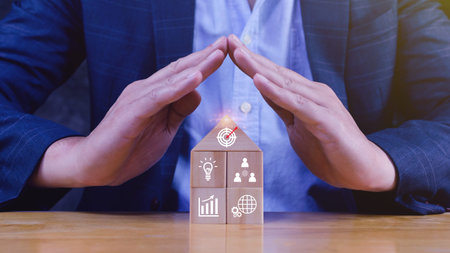 Hand arranging wood block stacking with business strategy and Action plan, targeting the business...
