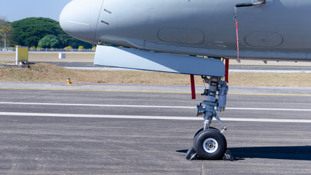 Close-up of front wheels of airplane with chock, Airplane parked at the airport, aircraft...