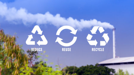 Reduce, reuse, recycle symbol with Metal factory, industry, dawn, smoke, cigarette smoke emissions, bad ecology, environment ozone air low carbon footprint production concept.の写真素材