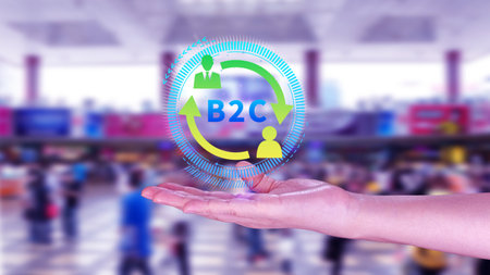 B2C, Business to customer marketing strategy concept. Businessman holding with virtual B2C icon for business strategy, communication, feedback, online marketing, Ecommerce marketing strategy.の写真素材