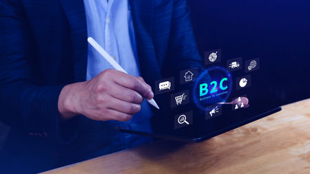 B2C, Business to customer marketing strategy concept. Businessman holding with virtual B2C icon for...