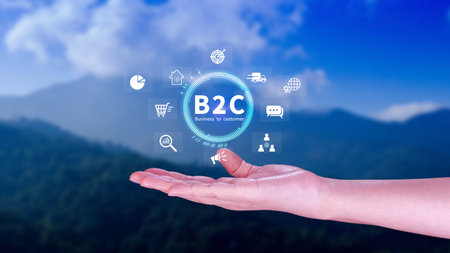 B2C, Business to customer marketing strategy concept. Businessman holding with virtual B2C icon for business strategy, communication, feedback, online marketing, Ecommerce marketing strategy.の写真素材