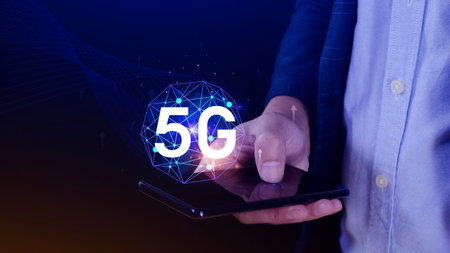 Business using smartphone with holographic 5G network concept, digital globe with interconnected 5G...