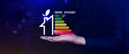 Energy efficiency concept, Businessman touching virtual screen of energy efficiency rating for energy efficient house building rate label audit, Renewable energy concept.の写真素材