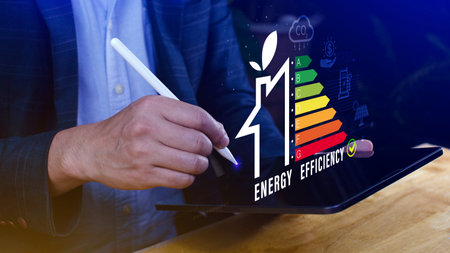 Energy efficiency concept, Businessman touching virtual screen of energy efficiency rating for energy efficient house building rate label audit, Renewable energy concept.の写真素材