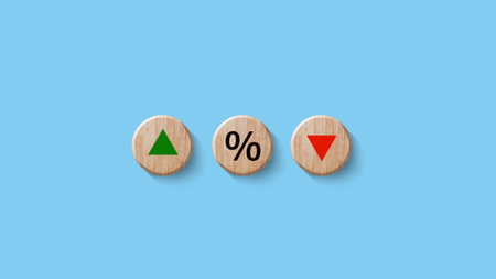 Financial, stocks, interest rate and GDP percent change, wooden block with percentage sign and arrow...