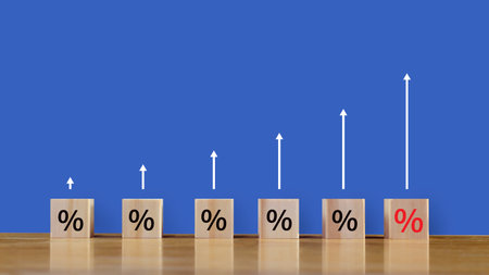 Financial, stocks, interest rate and GDP percent change, wooden block with percentage sign and arrow up sign for interest rate, rankingの写真素材