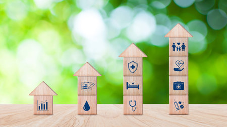 Health Insurance and medical care concept, wooden blocks displaying health related icons, medical...