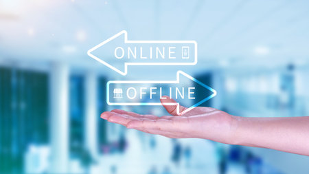Online vs offline business sales or marketing strategy concept, Transition from offline to online in commerce business.の写真素材