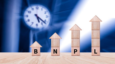 BNPL, Buy Now Pay Later concept. wooden cube with icons of BNPL with online shopping icons...