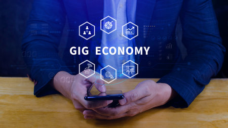 Gig economy. using a smartphone, freelance, hybrid workplace concept. combination of employment trend, growing to external hiring. not aiの写真素材