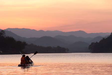 Young asian couple kayaking at Kangkajanの写真素材