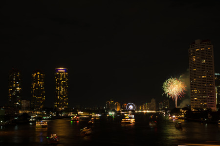 Night light landscape at Taksin bridge with firework,Bangkokのeditorial素材