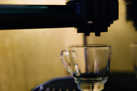 coffee machine preparing cup of coffee (espresso)の写真素材
