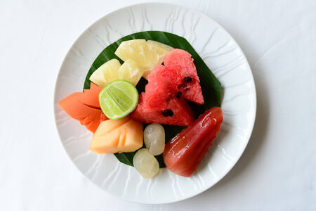 fruits on white plateの写真素材