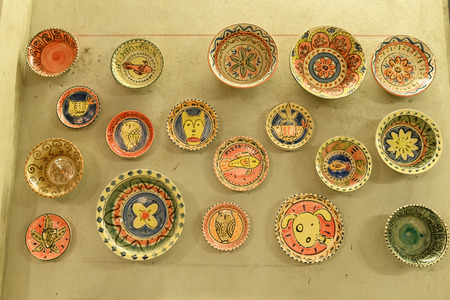 ceramic disc plate hanging on the wallの写真素材