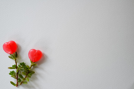 Artificial flowers made from sweet candy heart shape background for presentation.の写真素材