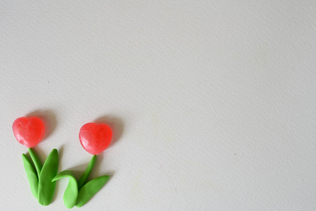 Flower made from plasticine and candy background for presentationの写真素材