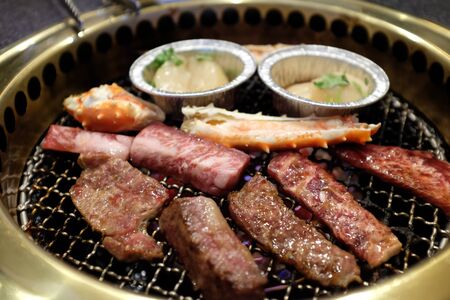 Barbecue with beef and Alaska crab mixedの写真素材