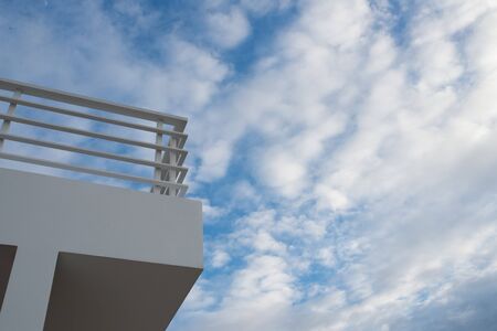 White balcony on blue skyの写真素材