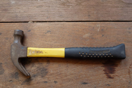 Hammer on wooden background.の写真素材