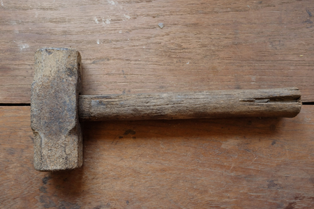 Hammer on wooden background.の写真素材