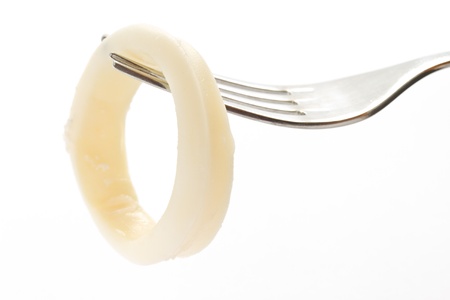 boiled squid ring on the plug on a white backgroundの写真素材