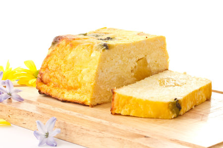 Fruit curd pudding with fruit on a wooden board