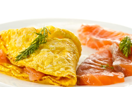 scrambled eggs with salted salmon on a plate