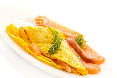 scrambled eggs with salted salmon on a plate