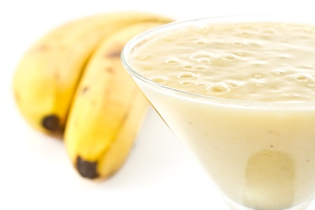 Banana shake with bananas on white backgroundの写真素材