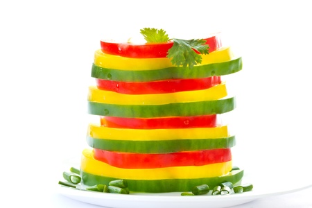 strips of peppers of different colors on a white backgroundの写真素材