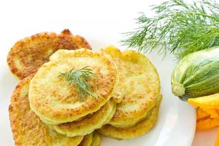 vegetable zucchini fritters on a plate closeup with dillの写真素材