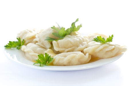 dumplings on a plate on a white backgroundの写真素材
