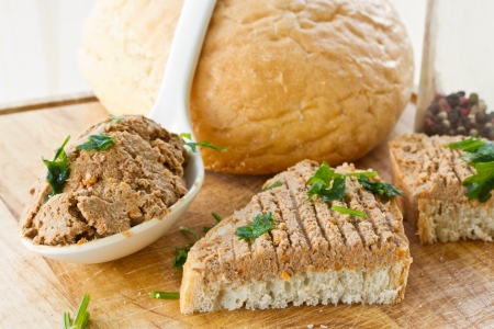 bread with homemade liver pate and herbsの写真素材