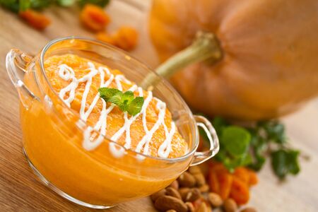 sweet pumpkin porridge background pumpkin and nutsの写真素材