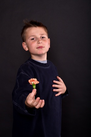 portrait of teenage boy on a black backgroundの写真素材