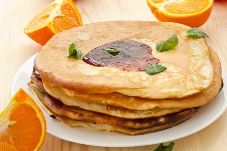 stack of pancakes on a plate of various fruitsの写真素材