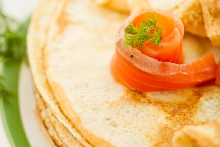 stack of pancakes with salted salmon on a plateの写真素材
