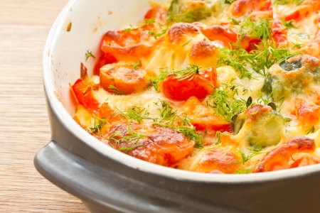 different vegetables baked with cheese in the ovenの写真素材
