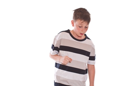 portrait of a cute teenage boy on white backgroundの写真素材