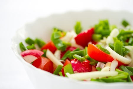 fresh salad with radishes and tomatoes with herbsの写真素材