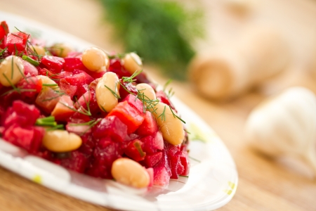 beet salad with cooked boiled white beansの写真素材