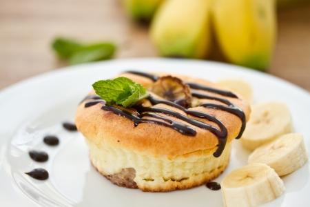 cheese cakes with bananas in chocolate with mintの写真素材