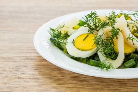 Salad with squid, eggs and fresh herbsの写真素材