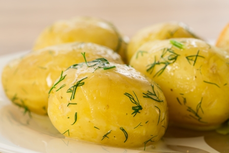 young boiled potatoes with dill in oilの写真素材